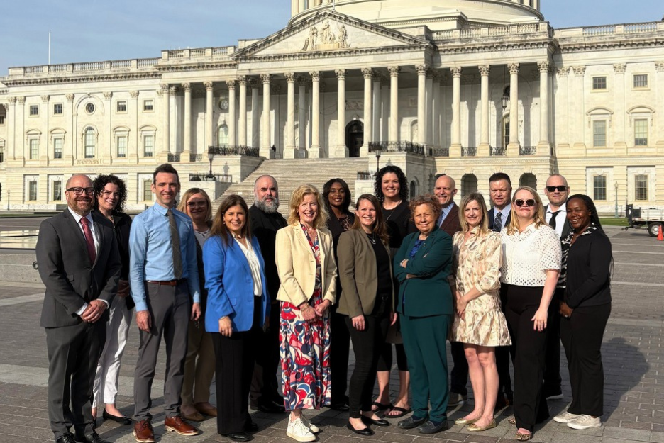 EnCircle staff stand with Lutheran Services of America staff at Capitol Hill