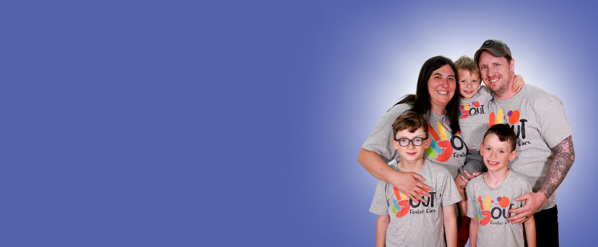 The Littles family smiles together at the camera