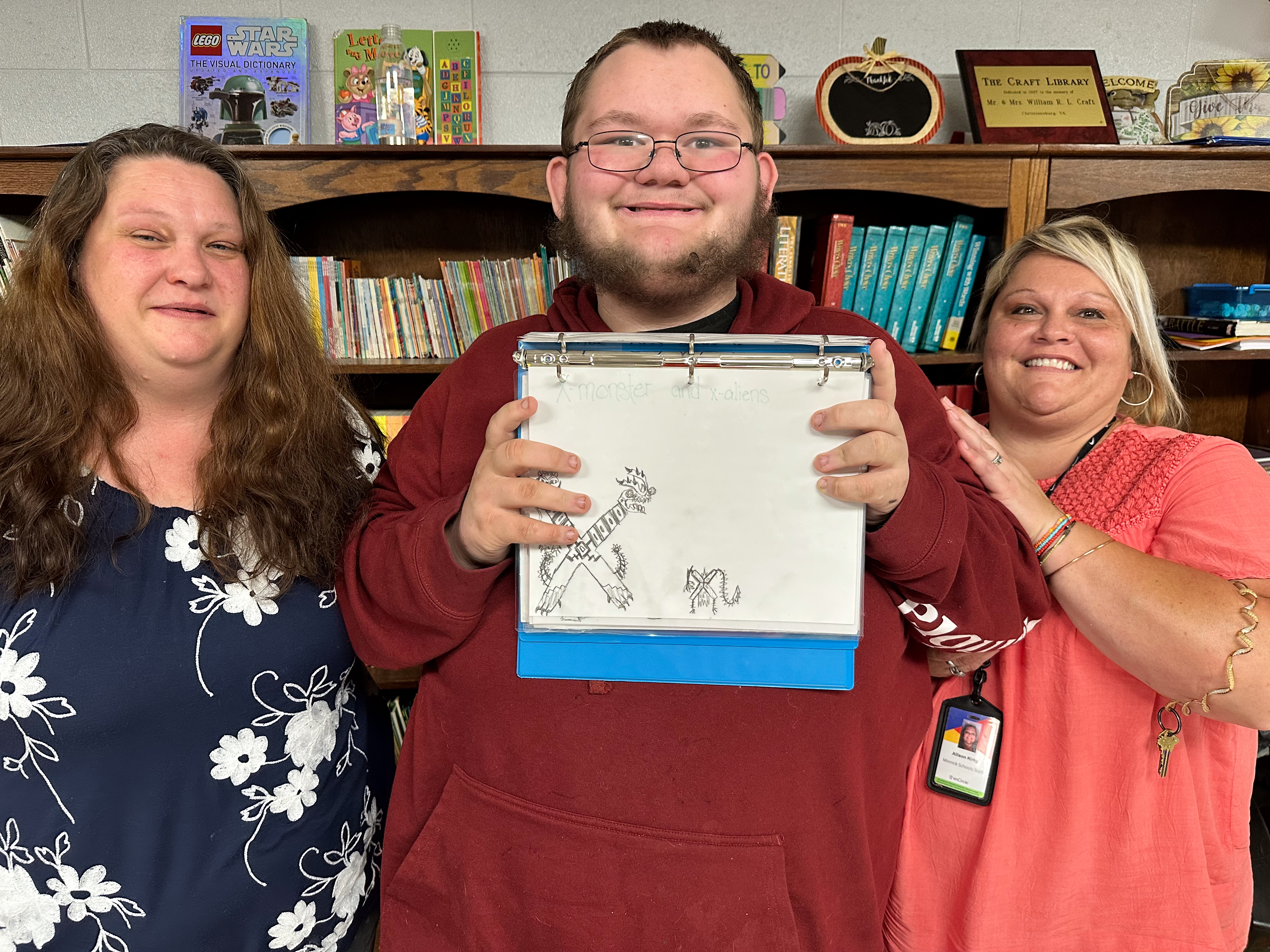 Robert Woody smiles with his artwork