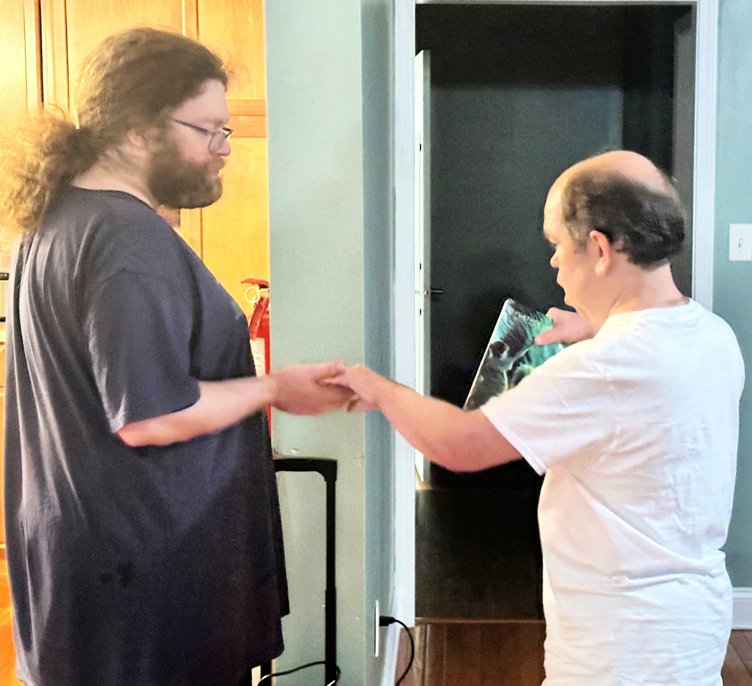 Tyler helps Group Home resident Dallas