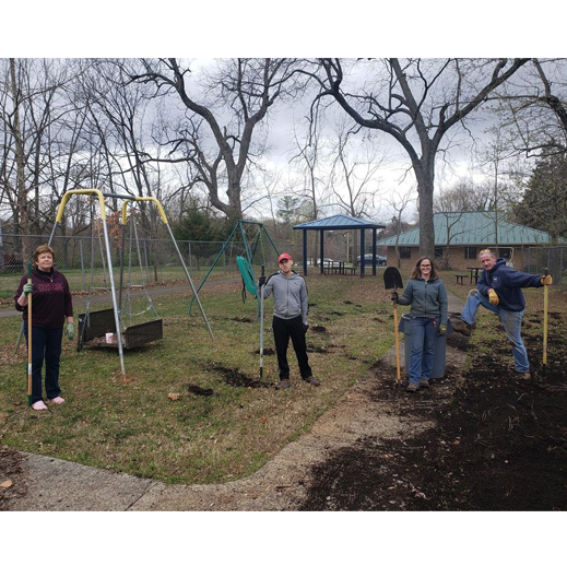 Framatome staff pose in Lynchburg Day Support gardens