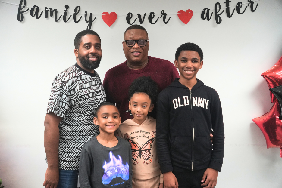 Adoptive family smiles together